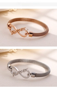Detail of mesh bracelet set with infinity symbol and Forever text in silver and rose gold