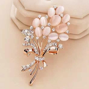 Elegant rose gold wheat flower brooch with pink opal stones and sparkling rhinestones