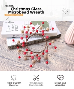 Close-up of red and gold glass micro-beads on a handcrafted Christmas candle wreath