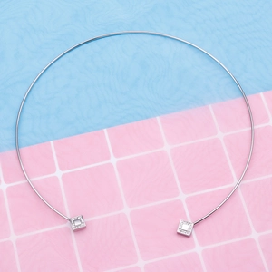 Silver stainless steel choker necklace with square diamond pendants on a grid background