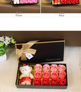 Detail of 12 gradient soap roses and a plush bear in a black gift box with gold ribbon