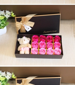 Close-up of 12 gradient pink soap roses and a cute teddy bear in a premium black gift box