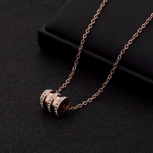 Rose gold titanium steel cylinder necklace with crystals in a minimalist design