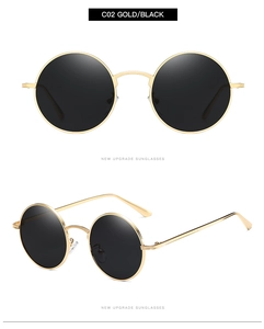 Detail view of round retro gold metal sunglasses with black lenses and slim frame structure