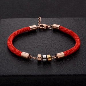 Three-tone titanium steel interlocking rings on red woven rope bracelet for luck