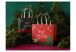 Festive red and green Christmas paper gift bags with handles and Merry Christmas text