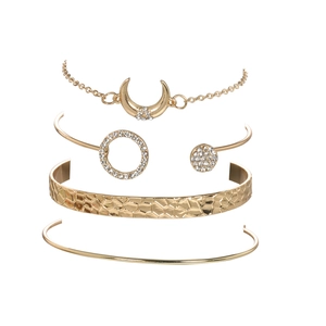 Golden 4-piece bracelet set featuring moon pendant, rhinestone ring, and hammered metal cuff