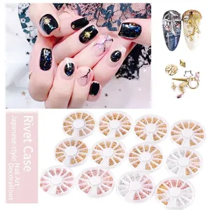 Star and moon nail art stud set with hollow alloy charms in 12-slot wheel display cases