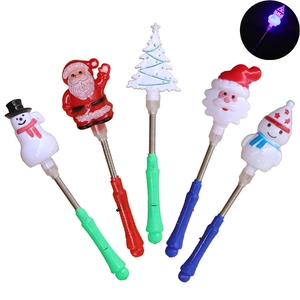 Close-up of assorted LED Christmas glow sticks with spring handles and colorful characters