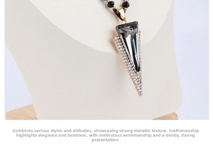 Detail of grey triangle crystal pendant with micro-paved diamonds on white neck bust