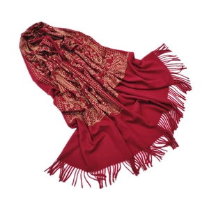 Detail of red cashmere pashmina with gold paisley embroidery and elegant fringes