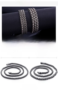 Detail view of 4mm and 5mm stainless steel wheat chain necklaces for men in retro silver