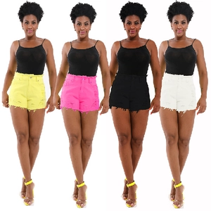 Detail of high waisted ripped denim shorts for women in four various bright colors