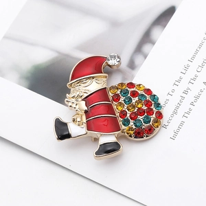 Santa Claus brooch with colorful rhinestones and enamel on white decorative paper