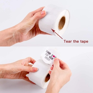 Roll of round Thank You For Your Order stickers with red heart and usage demo