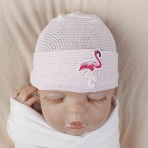 Detail of pink and white striped baby knit hat with embroidered flamingo on the brim