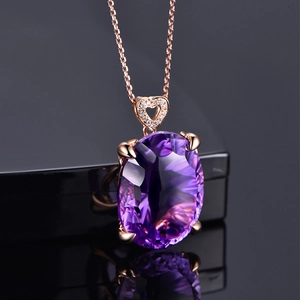 Macro shot of rose gold necklace featuring a large oval purple amethyst pendant