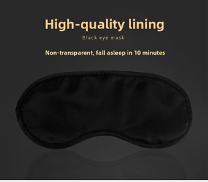 Macro shot of silk-like black sleep mask showing high-density light-blocking fabric texture