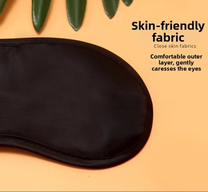 Close-up of a black blackout sleep mask featuring skin-friendly and breathable silk texture