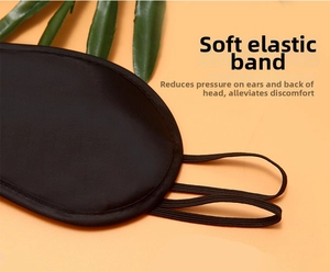 Close-up of black sleep mask featuring triple elastic straps for pressure relief