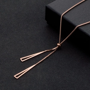 Rose gold triangle tassel titanium steel necklace with adjustable box chain on black background