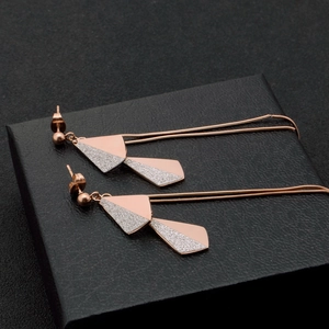 Elegant rose gold titanium steel long tassel leaf earrings with glitter finish and geometric design