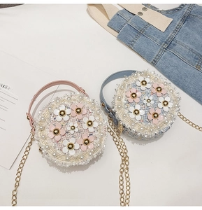 Detail of tweed crossbody bags with pearl trim and 3D floral accents for girls