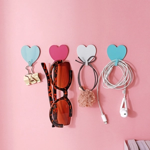 Set of four heart-shaped wall hooks in pastel colors for cute room decoration
