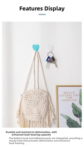 Detail showing heart wall hooks in white and blue, holding a bag and keys