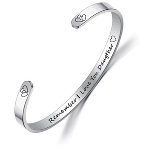 Close-up of silver engraved cuff bracelet with Remember I Love You Daughter message