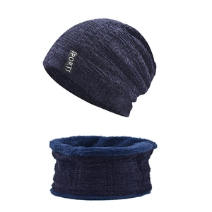 Detail of navy knit beanie and neck warmer set with thick fleece lining and sports tag