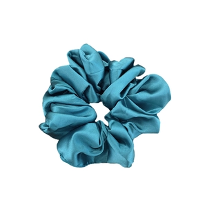 Peacock blue silk satin scrunchie with soft sheen and elegant pleated texture for hair