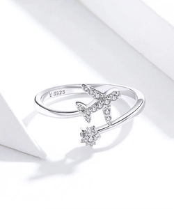 Detailed macro view of S925 sterling silver airplane ring with sparkling cubic zirconia stars