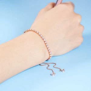 Detailed view of 3mm zircon tennis bracelet with adjustable rose gold slide clasp