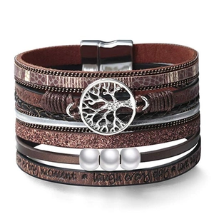 Close-up of multilayer brown leather bracelet with tree of life charm and magnetic clasp