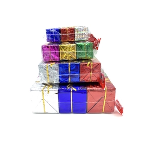 Close-up of colorful laser gift boxes for Christmas tree ornaments in vibrant metallic hues
