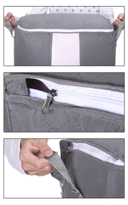 Macro details of non-woven storage bag with clear window, zipper and reinforced handle