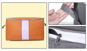 Detail view of the orange storage bag featuring reinforced handles and a sturdy metal zipper