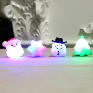 Set of 4 glowing Christmas LED rings featuring Santa, snowflake, snowman and Xmas tree