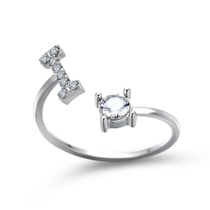 Detailed shot of silver adjustable ring featuring letter I pavé and four-prong stone