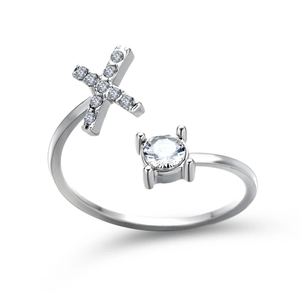 Detail of adjustable silver cross ring with sparkling round solitaire and micro-pave diamonds