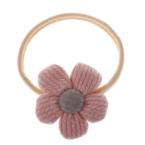 Detail of pink fabric flower headband for babies with beige elastic band and gray stamen