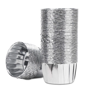 Macro shot of silver aluminum foil cupcake liners with rolled edges and greaseproof finish