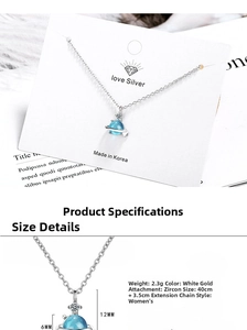 Macro detail of blue planet pendant with zircon on s925 silver short clavicle chain