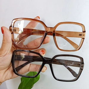 Detail view of square eyeglass frames in amber and transparent gray, model Z3337