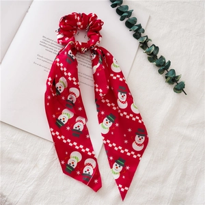 Red Christmas hair scrunchie with long ribbons featuring snowman and snowflake prints