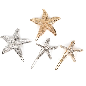 Set of 4 gold and silver starfish hair clips with textured metal and rhinestone inlay