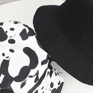 Detail shot of a double-sided reversible panda bucket hat with premium stitching