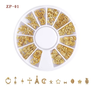 Macro view of 12-grid wheel box with golden moon and star nail art metal studs