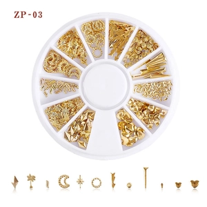 Detailed set of golden Japanese star and moon nail art studs in a 12-slot storage case